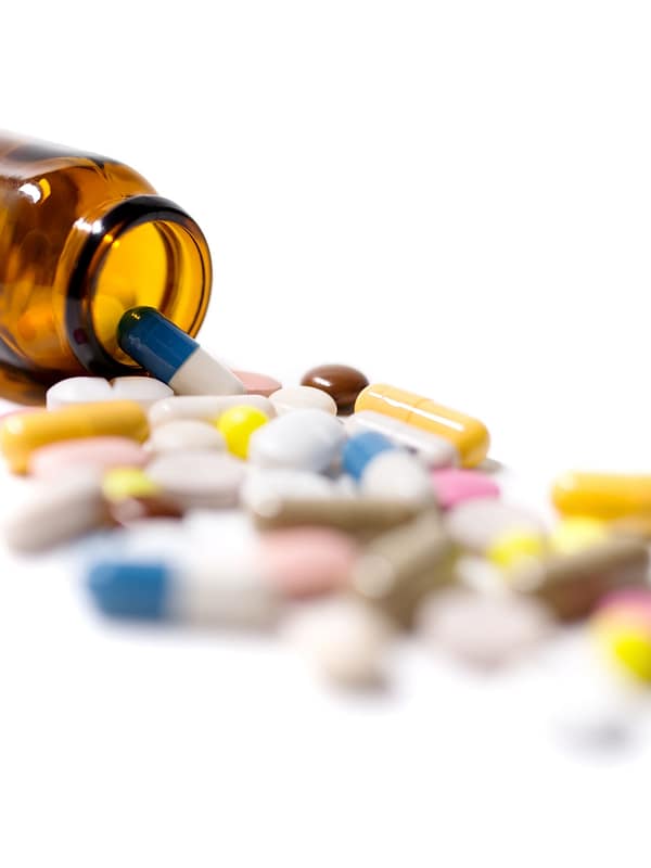 58402771 – medicine pills and capsules on a white background